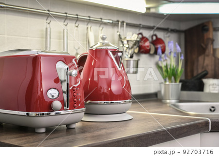 Red toaster and electric kettle in retro slile 92703716