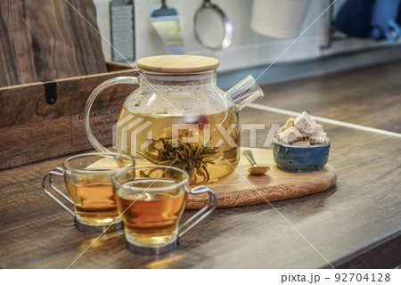 Blooming flowering tea in glass teapot Blooming flowering tea in glass teapot 92704128