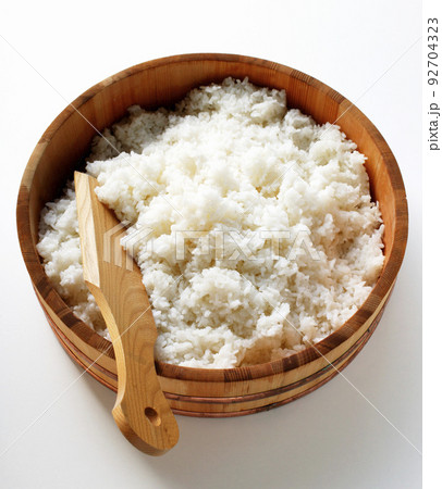 White steamed rice in wooden round bowl White steamed rice in wooden round bowl 92704323