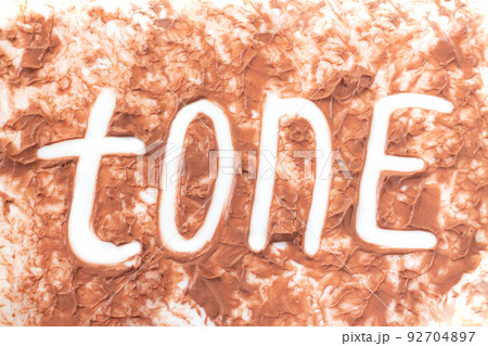 Swatch of foundation tone cream texture background 92704897