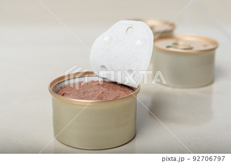Pet food in the form of pate in an open tin. Pet food in the form of pate in an open tin. 92706797