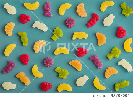 Jelly candies in shape of fruits, trees and birds as pattern Jelly candies in shape of fruits, trees and birds as pattern 92707004