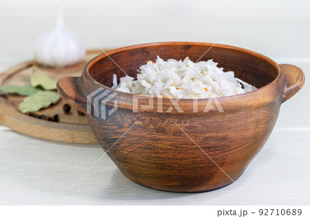 Homemade with carrot and salad cabbage on a wooden table. 92710689
