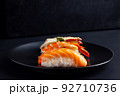 Japanese seafood sushi on black background. 92710736