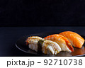 Japanese seafood on dark background. Sushi Set. 92710738