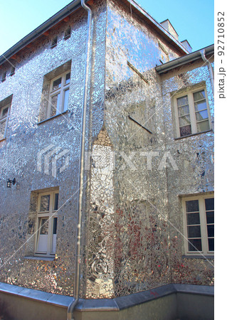 Building with mirrored walls. Facade of building made of mirror fragments 92710852