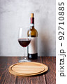 Red wine glasses and bottle on wooden background. 92710885