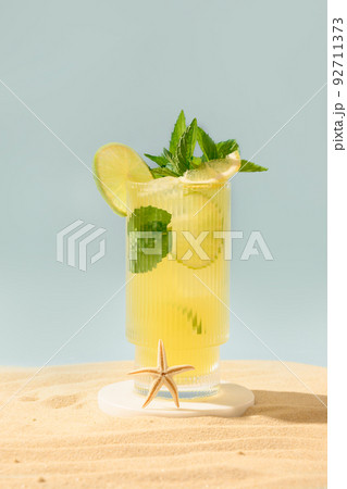 Freshness mojito cocktail on beach in sunny shadow. Freshness mojito cocktail on beach in sunny shadow. 92711373