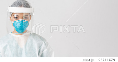 Covid-19, coronavirus disease, healthcare workers concept. Close-up of confident serious-looking female tech lab employee, doctor in personal protective equipment, respirator and face shield Covid-19, coronavirus disease, healthcare workers concept. Close-up of confident serious-looking female tech lab employee, doctor in personal protective equipment, respirator and face shield 92711679
