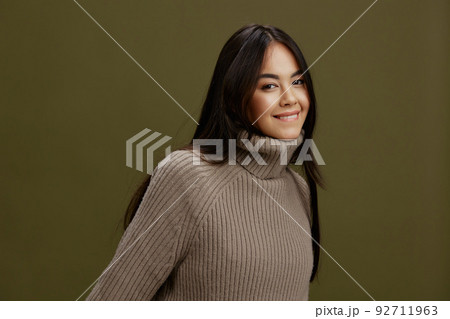 pretty woman in a sweater posing smile clothing fashion isolated background pretty woman in a sweater posing smile clothing fashion isolated background 92711963