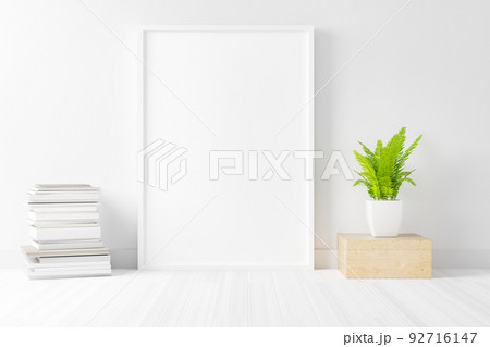 Blank empty picture frame mockup on white cement wall. Blank empty picture frame mockup on white cement wall. 92716147