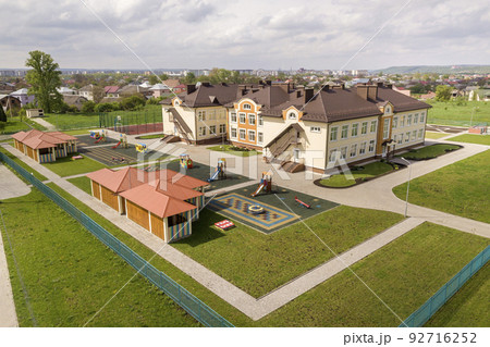 Aerial view of new prescool building in residential rural area. 92716252