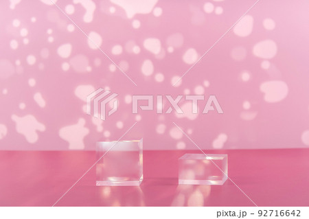 Acrylic blocks on pink background, pedestal cosmetic display glass podium platform for product presentation, geometric stand for cosmetics, mockup scene for jewellery Acrylic blocks on pink background, pedestal cosmetic display glass podium platform for product presentation, geometric stand for cosmetics, mockup scene for jewellery 92716642