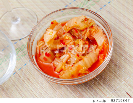 Korean spicy pickled napa cabbage kimchi in salad bowl Korean spicy pickled napa cabbage kimchi in salad bowl 92719347