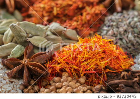 Spices. Aromatic Indian spices on a slate background. Spices and herbs on a stone background. Spices. Aromatic Indian spices on a slate background. Spices and herbs on a stone background. 92720445