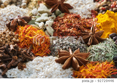 Spices. Aromatic Indian spices on a slate background. Spices and herbs on a stone background. Spices. Aromatic Indian spices on a slate background. Spices and herbs on a stone background. 92720446