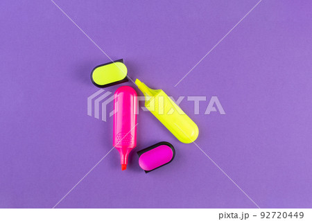 School drawing tools. Yellow triangle and ruler on a purple background. School stationery School drawing tools. Yellow triangle and ruler on a purple background. School stationery 92720449