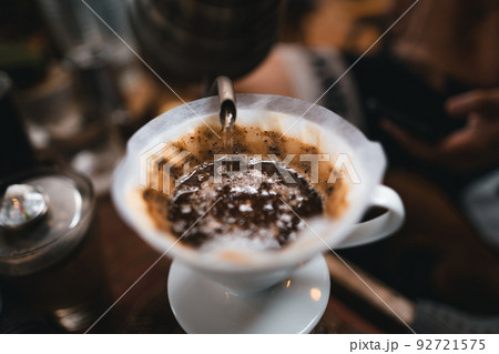 Closeup of hands barista make coffee Closeup of hands barista make coffee 92721575