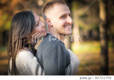Man and woman hugging smiling and having fun together in outdoor leisure activity Man and woman hugging smiling and having fun together in outdoor leisure activity 92721759