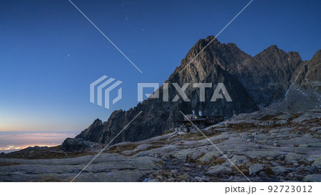 Peaceful alpine scenery with mountain and hut beneath it just before sunrise, Slovakia, Europe 92723012
