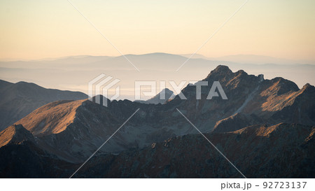 Alpine landscape with mountain ranges, peaks catching last light during sunset, Europe, Slovakia 92723137