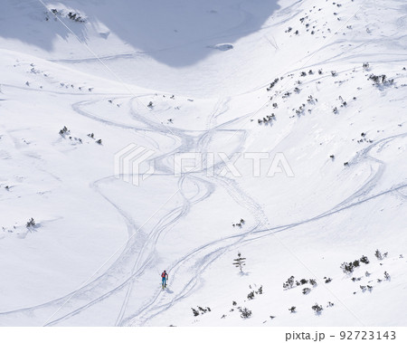 Ski alpinist roaming through alpine valley full of snow, Slovakia, Europe 92723143