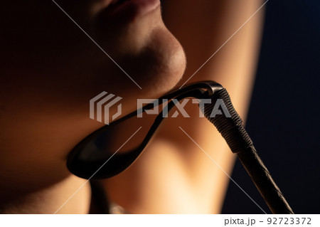 Photo of woman chin with leather lash 92723372