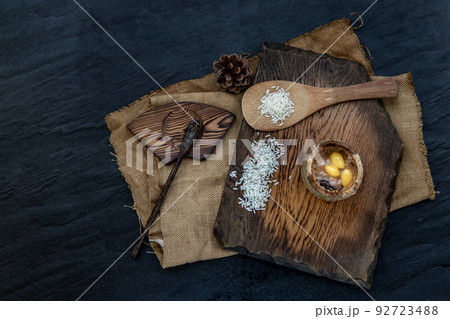 Sticky Rice Cooked with Coconut milk (Khao lam) or Glutinous rice roasted in bamboo joints on wooden, Thai dessert concept. Sticky Rice Cooked with Coconut milk (Khao lam) or Glutinous rice roasted in bamboo joints on wooden, Thai dessert concept. 92723488