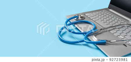 Online doctor consultation, Virtual hospital and online therapy. stethoscope lies on laptop keyboard on blue background. Healthy Hardware. copy space. banner Online doctor consultation, Virtual hospital and online therapy. stethoscope lies on laptop keyboard on blue background. Healthy Hardware. copy space. banner 92723981