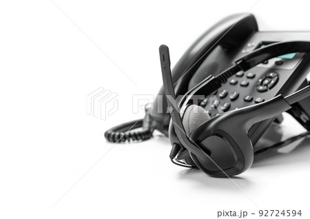 communication technology concept. black ip phone and headset isolated on white background communication technology concept. black ip phone and headset isolated on white background 92724594