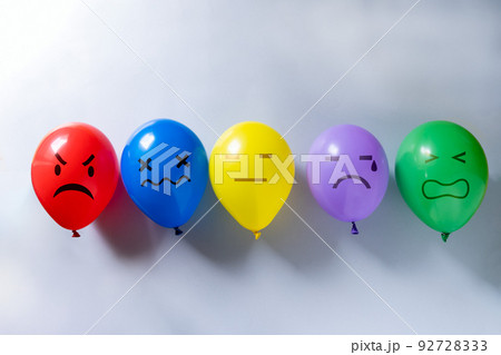 Mental health concept - selection of emojis on colorful balloons for different mental states Mental health concept - selection of emojis on colorful balloons for different mental states 92728333