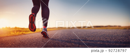 Woman running outdoors on the evening sunset. Woman running outdoors on the evening sunset. 92728797