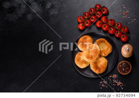 Traditional homemade pies with cabbage and sauerkraut on the plate 92734094