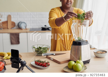 Woman Making Smoothie Woman Making Smoothie 92735463