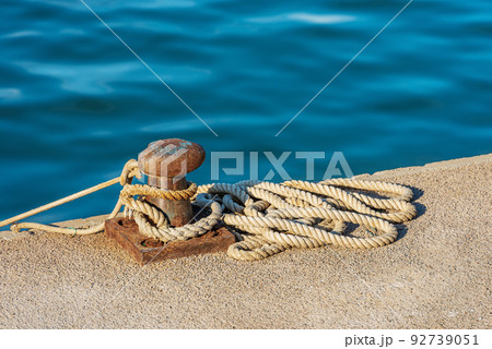 Rusty Mooring Bollard with Ropes in the Port - La Spezia Italy 92739051