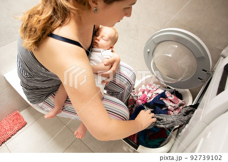 Performing role of good mother and perfect housewife 92739102