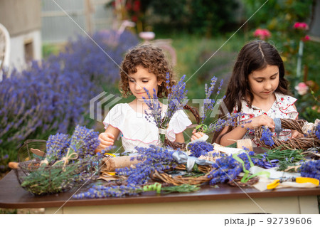 Girls make homemade lavender wreaths as a decorの写真素材