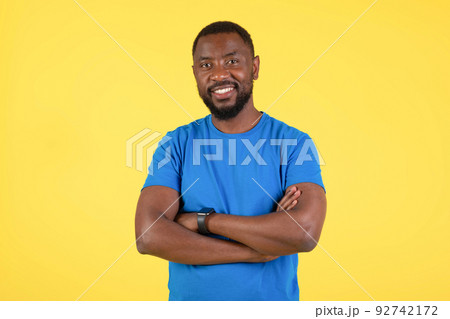 Happy African American Man Posing Smiling Standing Over Yellow Background 92742172