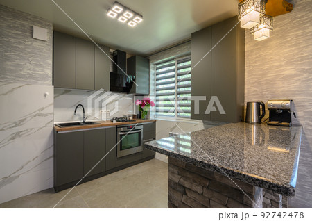Interior of modern trendy grey kitchen 92742478