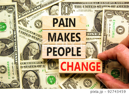 Pain makes people change symbol. Concept words Pain makes people change on wooden blocks on a beautiful background from dollar bills. Business, motivational and pain makes people change concept. Pain makes people change symbol. Concept words Pain makes people change on wooden blocks on a beautiful background from dollar bills. Business, motivational and pain makes people change concept. 92743459
