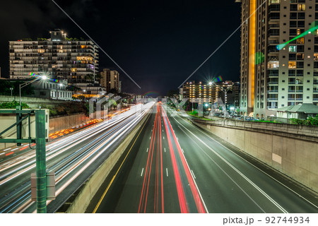 evening commute on H1 Freeway at night in honolulu hawaii 92744934