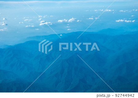 View of blue cloudy sky from airplane window 92744942