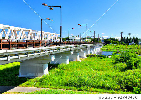 日野橋／多摩川 下流／日野市側より柴崎体育館駅、立川駅方面を望む(東京都日野市)【2022.7】 92748456