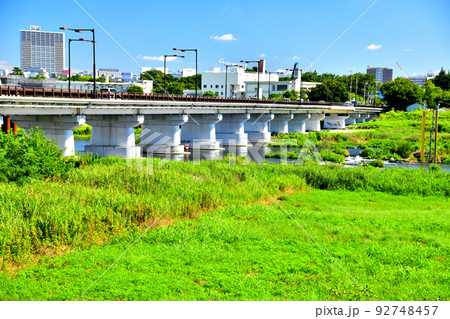 日野橋／多摩川 下流／日野市側より柴崎体育館駅、立川駅方面を望む(東京都日野市)【2022.7】 92748457