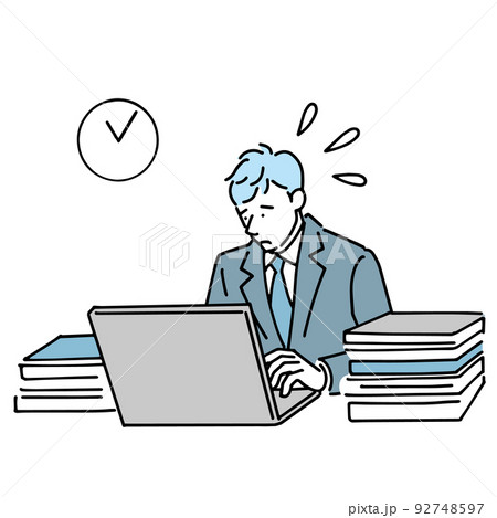 山のような仕事を抱えて残業する会社員男性 92748597