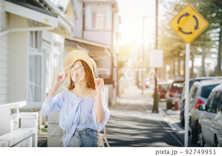 Young asian tourist enjoying her holiday with beautiful sightseeing buildings in Napier town of North Island, New Zealand. Young asian tourist enjoying her holiday with beautiful sightseeing buildings in Napier town of North Island, New Zealand. 92749951