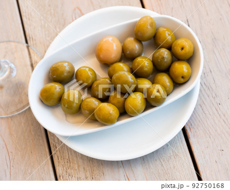 Pickled green olives with a stone 92750168