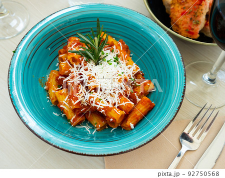 Rigatoni pasta with tomato sauce, goat cheese 92750568