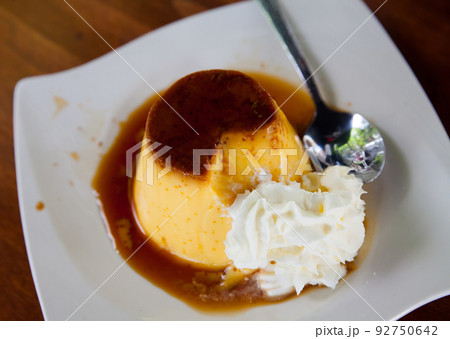 Caramel flan with whipped cream Caramel flan with whipped cream 92750642