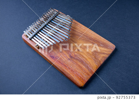 Traditional wooden kalimba isolated on black Traditional wooden kalimba isolated on black 92755373